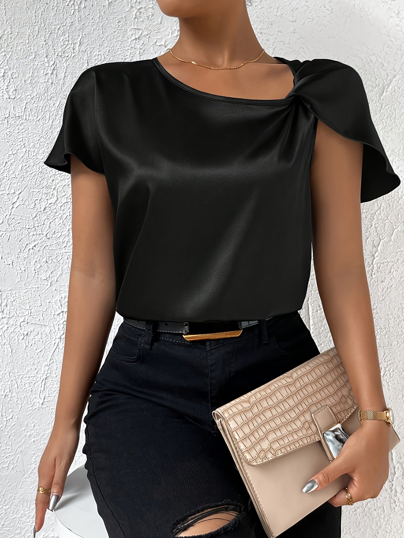 Modern top with eye-catching shoulders for women