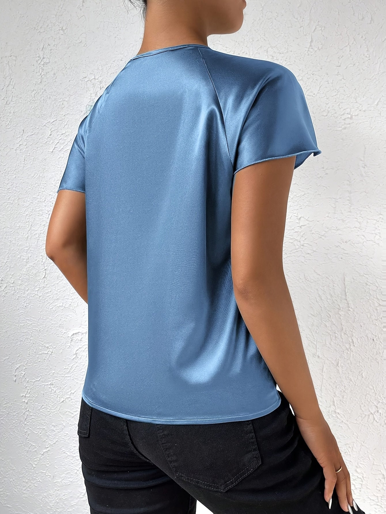 Modern top with eye-catching shoulders for women