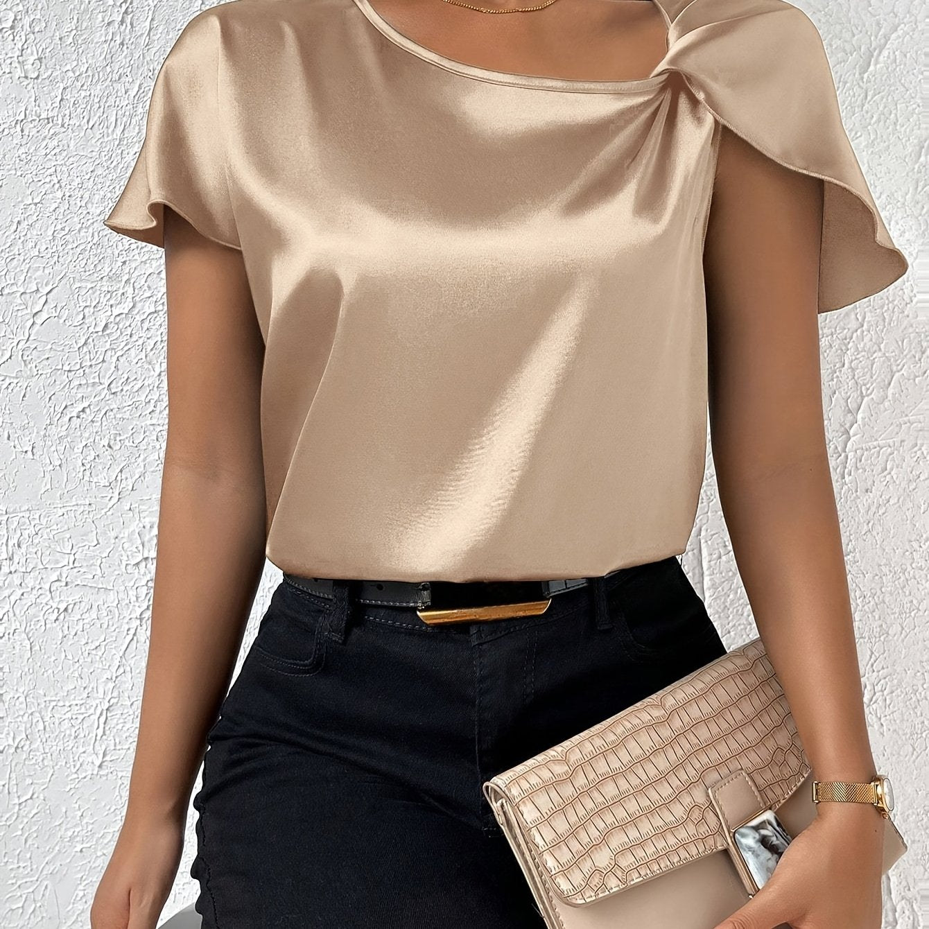 Modern top with eye-catching shoulders for women