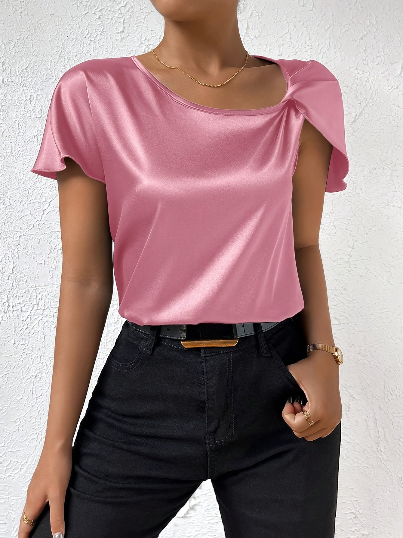Modern top with eye-catching shoulders for women