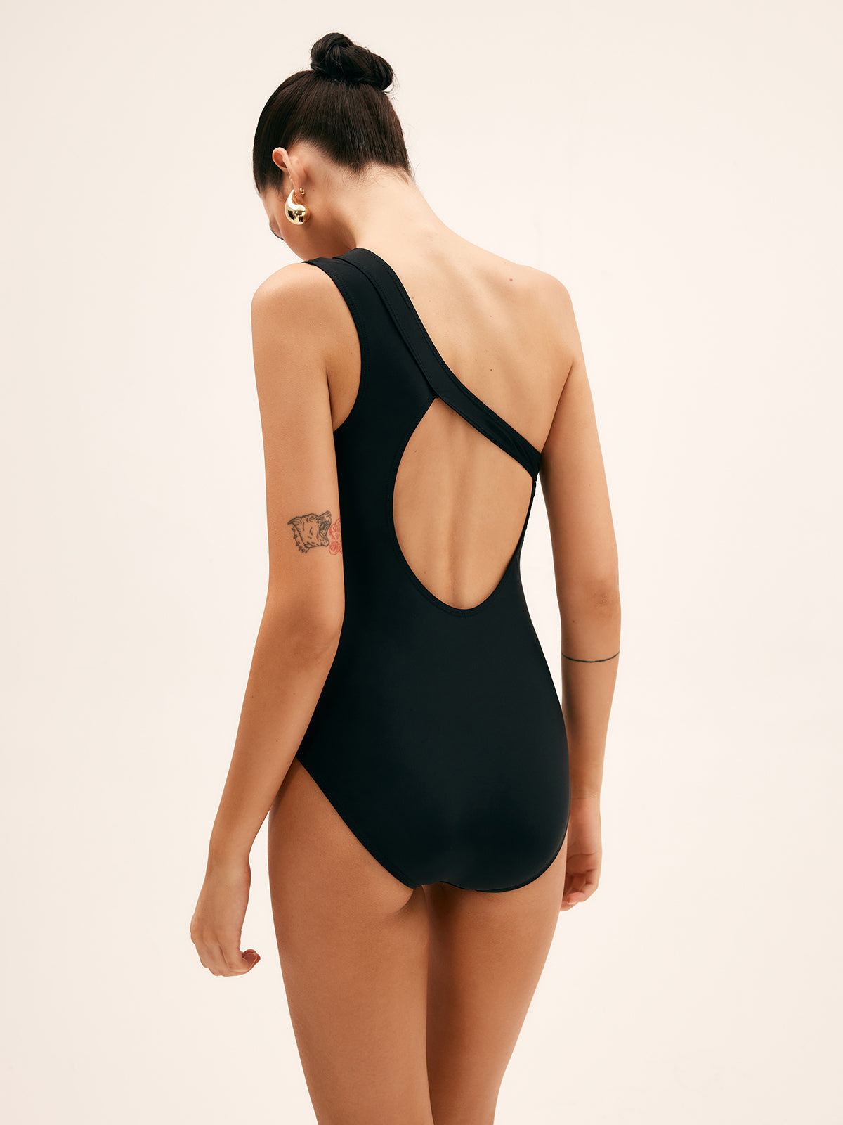 Asymmetrically cut swimsuit for women