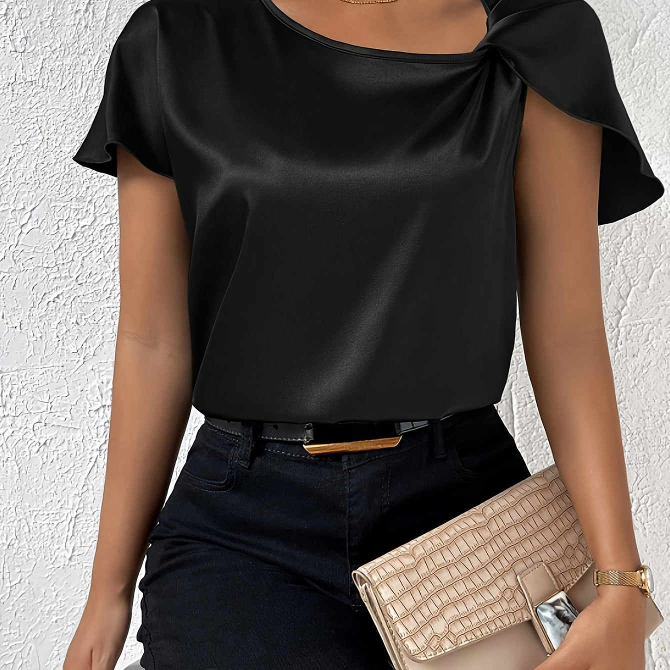 Modern top with eye-catching shoulders for women