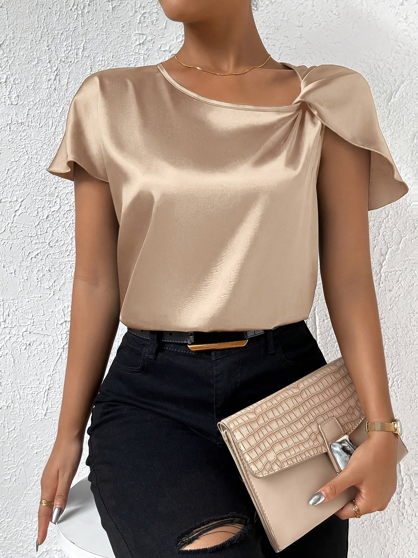 Modern top with eye-catching shoulders for women