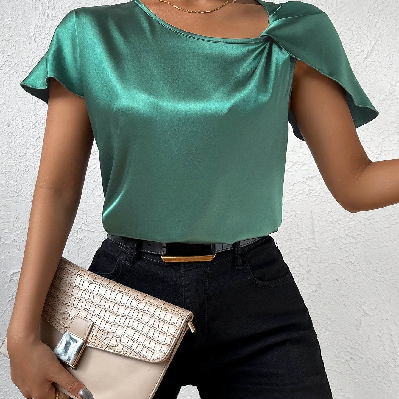 Modern top with eye-catching shoulders for women